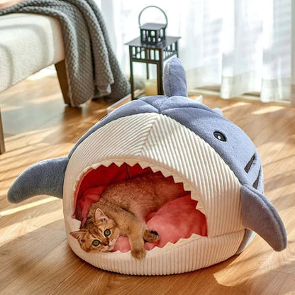 Luxury Plush Shark Pet Bed with a cat curled up inside for cozy comfort and playful design.