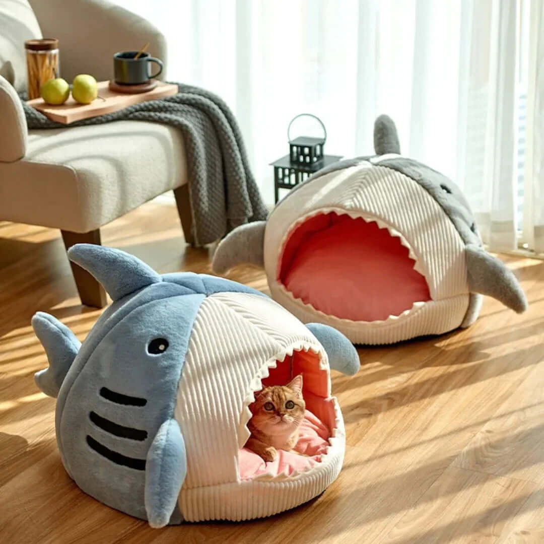 Luxury Plush Shark Pet Bed in cozy setting with cat inside and another bed nearby.